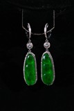 A PAIR OF JADEITE AND DIAMOND PENDANTS