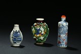 A SET OF THREE CERAMIC SNUFF BOTTLES