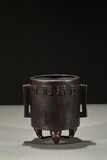 A BRONZE TRIPOD ELEPHANT-FEET CENSER