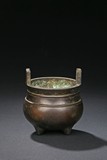 A GLOBULAR BRONZE TRIPOD CENSER 