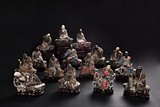 A GROUP OF POLYCHROME CLAY ARHAT FIGURES