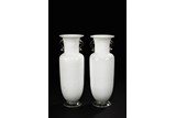 A PAIR OF WHITE AND CLEAR GLASS ROULEAU BOTTLES
