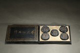 SET OF FIVE GILT INSCRIBED BARREL-FORM INKCAKES