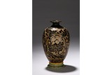 A CARVED DARK BROWN GLAZED VASE 