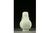 A WHITE JADE ‘INSCRIPTION' HU VASE AND COVER
