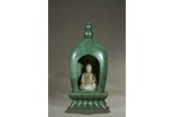 A SPINACH GREEN JADE PAGODA AND WHITE JADE BUDDHA