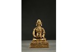 A GILT-BRONZE FIGURE OF ARHAT