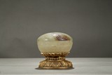 A CIRCULAR COVER BOX ON GILT BRONZE STAND