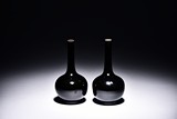 A PAIR OF MIRROR BLACK GLAZED VASES