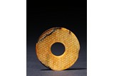 A LARGE YELLOW JADE 'SPIRAL' DISC BI