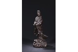 A BLACK DRY LACQUER FIGURE OF STANDING GUANYIN