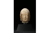 A WHITE MARBLE CARVED HEAD OF BODHISATTVA 