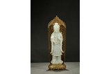 A WHITE JADE GUANYIN WITH GILT BRONZE BACKSPLAT