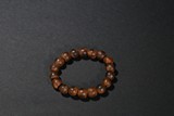 A SANDALWOOD BEAD BRACELET