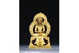 A GILT BRONZE FIGURE OF AMITABHA