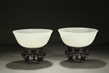 A PAIR OF WHITE JADE CARVED 'AMITABHA' BOWLS