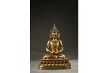 A GILT-BRONZE FIGURE OF AMITABHA