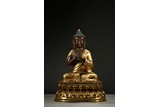 A PARCEL-GILT FIGURE OF BUDDHA