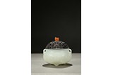 A WHITE JADE 'SHOU' TRIPOD CENSER WITH COVER