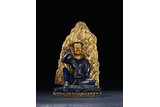 A LAPIS LAZULI CARVED FIGURE OF MILAREPA
