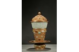 A GILT-BRONZE WHITE JADE 'EIGHT EMBLEM' RITUAL CUP