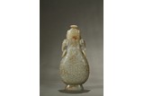 A WHITE JADE 'ARCHAISTIC' ELEPHANT HANDLE VASE