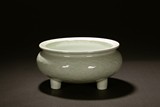 A LONGQUAN CELADON 'LOTUS' TRIPOD WASHER