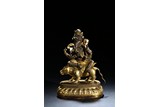 A GILT BRONZE FIGURE OF GANESHA
