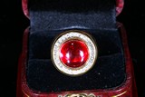 A RED GEM AND DIAMOND GOLD RING