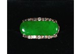 A JADEITE AND DIAMOND GOLD RING