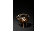 A GILT-SPLASHED BRONZE TRIPOD CENSER