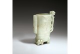 A GREEN WHITE JADE 'CHILONG' VESSEL
