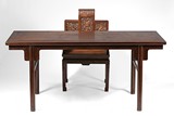 A HUANGHUALI OR HARDWOOD PAINTING TABLE AND ARMCHAIR