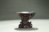 AN AGARWOOD CARVED LIBATION CUP