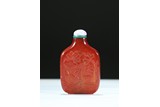 AN AMBER CARVED 'LOTUS AND DUCKS' SNUFF BOTTLE