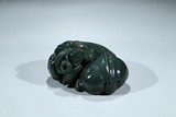 A SPINACH GREEN JADE 'RAM' PAPERWEIGHT