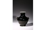 A MIRROR BLACK GLAZED VASE