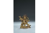 A GILT BRONZE FIGURE OF BEGTSE