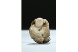 A GRAYISH WHITE JADE CARVING OF BOY