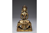 A GILT-BRONZE FIGURE OF AMITAYUS