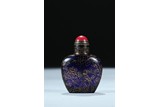 A GILT PAINTED BLUE GLASS SNUFF BOTTLE