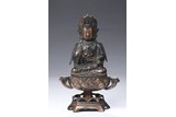 A BRONZE PARCEL GILT FIGURE OF GUANYIN