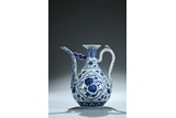 A BLUE AND WHITE 'FRUIT AND PEACH' EWER