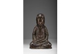 A PARCEL-GILT BRONZE FIGURE OF SEATED GUANYIN