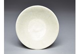 A WHITE GLAZED DISH