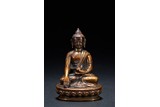 A SMALL BRONZE FIGURE OF SEATED SHAKYAMUNI