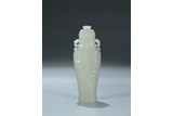 A WHITE JADE CARVED ARCHAISTIC VASE AND COVER