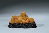 A SHOUSHAN 'TIGER-TAMING LUOHAN' CARVING