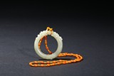 A WHITE JADE DRAGON RING PENDANT