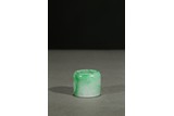 A JADEITE CARVED THUMB RING